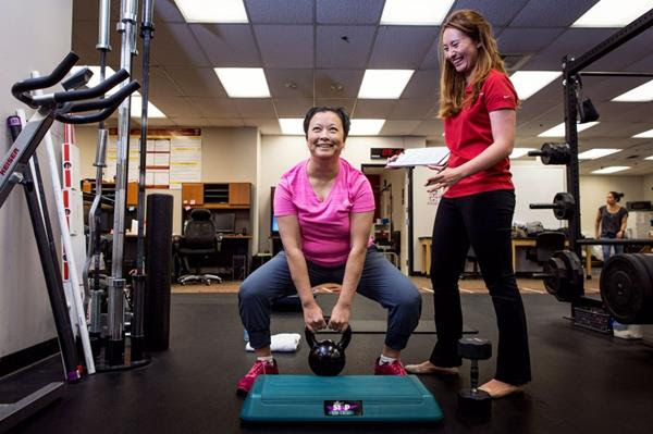 Woman exercising photo by Christina Gandolfo