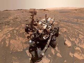 Curiosity rover on Mars in a self portrait.