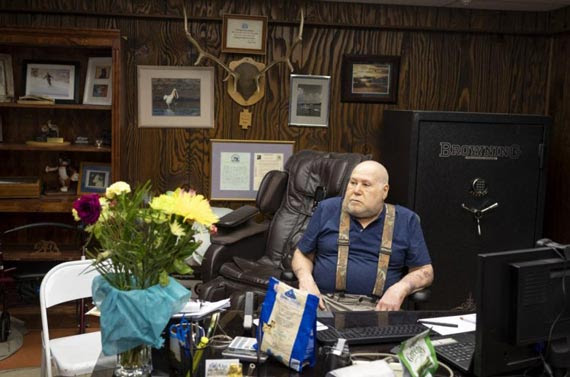 Jerry Wigutow sitting at his desk