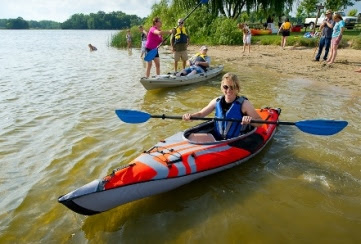A kayaker enjoying time on Michigan waters. A kayaker enjoying time on Michigan waters.