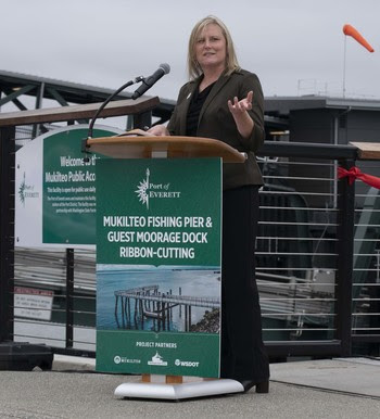 Photo of Chief of Staff Nicole McIntosh speaking behind a podium on the Mukilteo waterfront