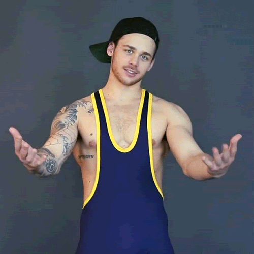 piledriveu: backwards cap..singlet...bit of chest hair peaking thru between the pecs.....encourging me to get over there in a cocky way..FUCK YA LETS WRESTLE!!!!! 