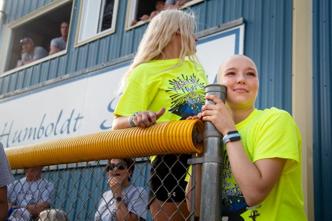 Ashlyn Clark looks out at the softball field as the charity softball game kicks off, raising money for the Clark family on Thursday, June 27, 2019, in Humboldt. "It's indescribable," Ashlyn said of the event, "they are coming together for me." Just days after graduating high school Ashlyn Clark wasn't feeling right and a trip to the doctor explained why. She had Hodgkin's lymphoma. The multi-sport athlete was determined to keep playing softball so between chemo treatments she still takes the field with her teammates.