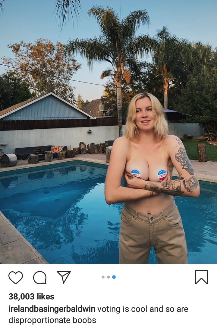 Model Ireland Basinger  Baldwin lets her breasts hang out as she urges people to vote (photos)