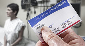 Healthcare provider showing closeup of Medicare health insurance card