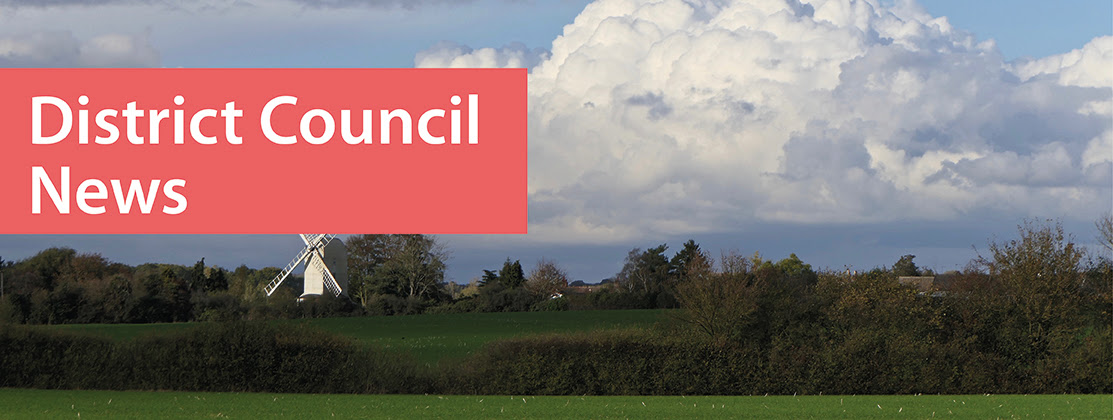 Header which says District Council News. Windmill in the background. 