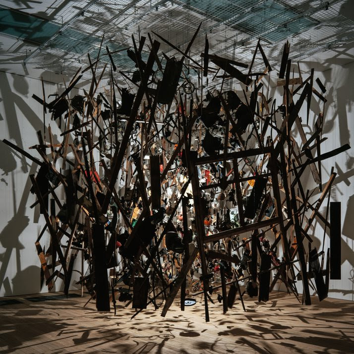 Cold Dark Matter by Cornelia Parker, photograph of installation featuring an exploding shed suspended in space