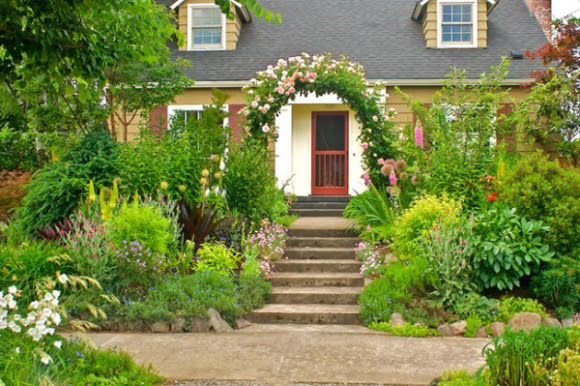Front yard with rose-covered arch entry