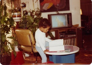 Me at 3 with the Webster's Collegiate Dictionary on a Fisher-Price Table--You can't see it but my toy stove and cooking set is in the background...