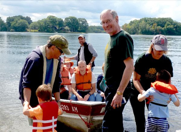 Brian helps take visitors to Elizabeth Island during Spy Pond Fun Day in September 2017. / Land Trust photo
