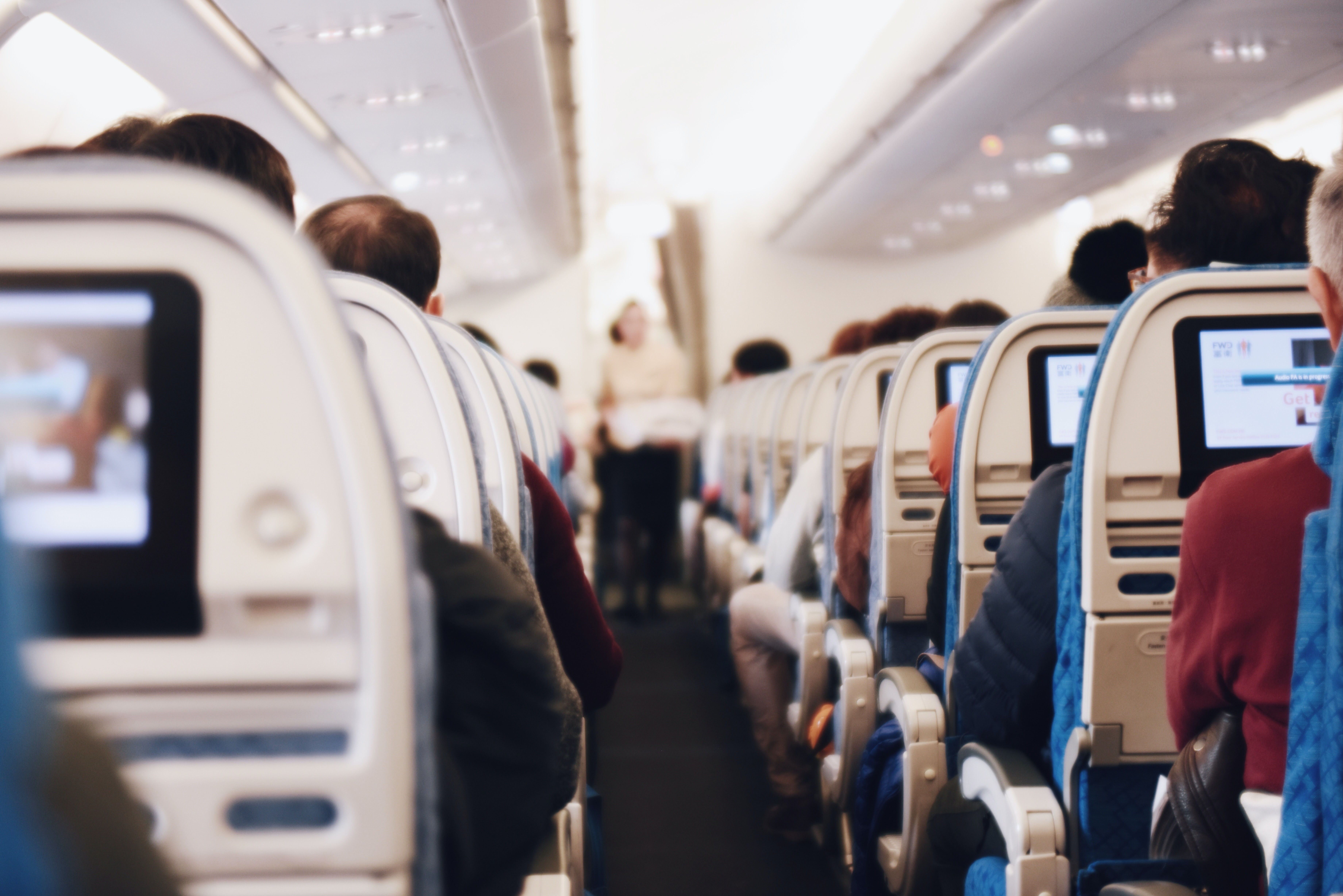 Looking down the aisle of an full aircraft