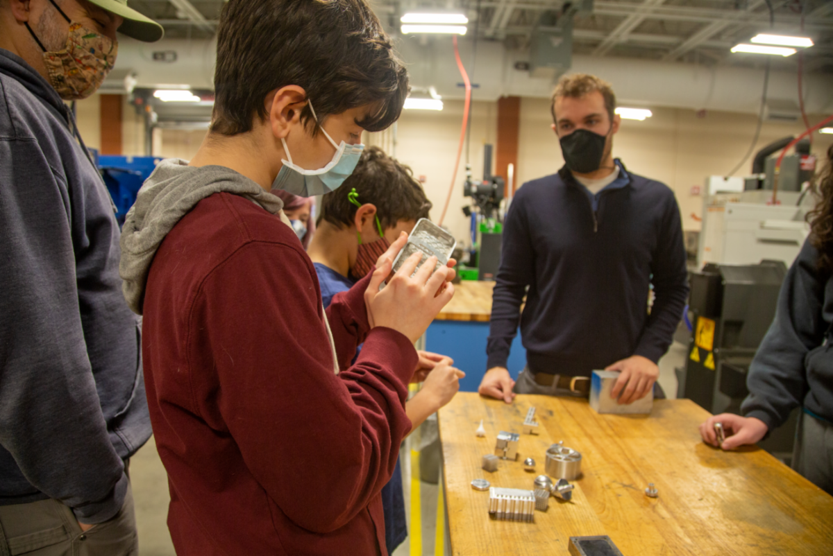 A demonstration for a family in the Engineering and Robotics learning space at the Minuteman High School's annual open house on Sunday, Nov. 21. (Photo by Reba Saldanha/Minuteman High School)