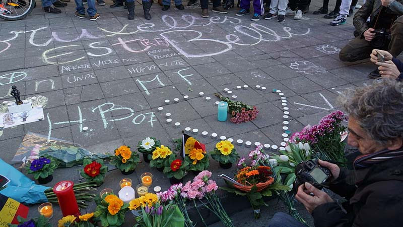 People gathering, chalk drawings and flowers for the victims of the 2016 Brussels suicide bombing.
