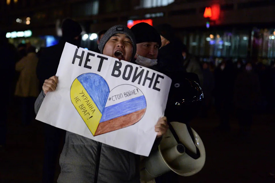 Police officer detain a demonstrator with the poster reading No war during an action against Russia's attack on Ukraine in Moscow, Russia, Thursday, Feb. 24, 2022. Hundreds of people gathered in the center of Moscow and St. Petersburg on Thursday, protesting against Russia's attack on Ukraine. Many of the demonstrators were detained. Similar protests took place in other Russian cities, and activists were also arrested. (AP Photo/Denis Kaminev)