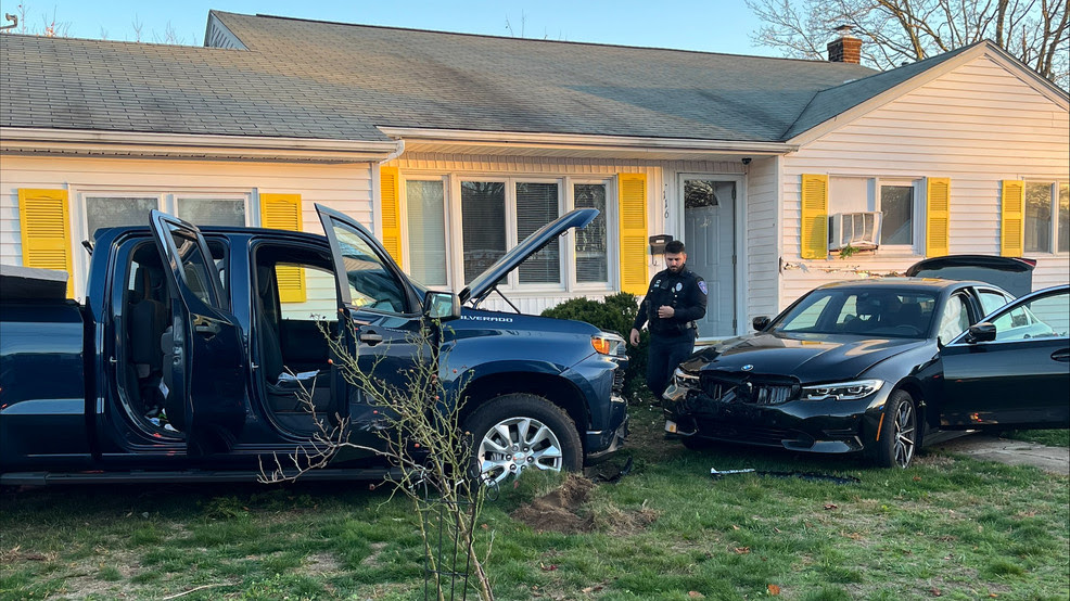  Warwick crash ends with car, pickup truck in front yard of home