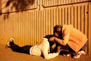 Israeli women take cover as a siren sounds warning about incoming rocket fired from Gaza. (archive)