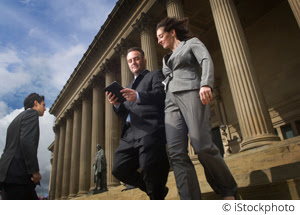 Lawyers walking down courthouse steps.