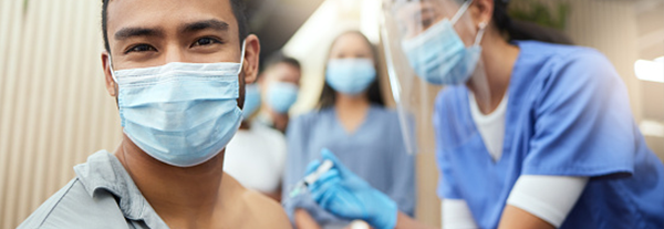 Young man getting COVID-19 booster vaccination