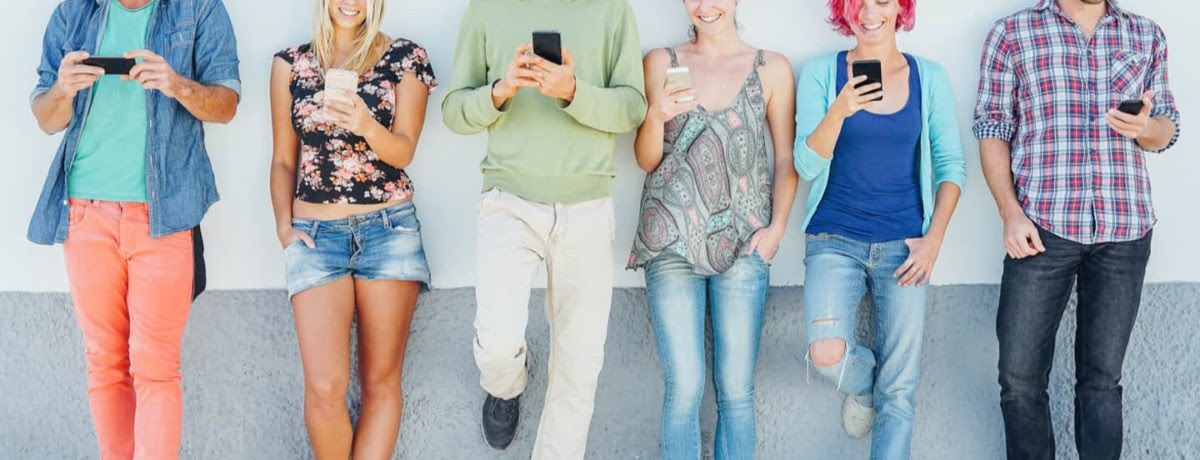 A group of people on their phones