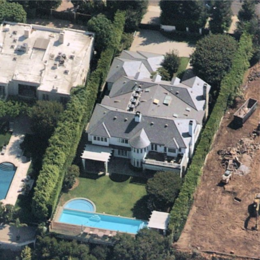 Aerial view of homes with swimming pool