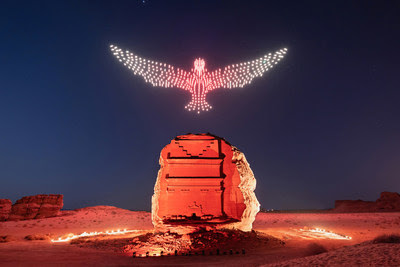A drawing of a flying falcon above the Tomb of Lyhian Son of Kuza at Hegra, the first UNESCO World Heritage Site in the Kingdom of Saudi Arabia. Hegra’s Drone Light Show explores the origins and beauty of light in its purest form through a performative artwork at the intersection of technology where luminous drones will fly in the dark sky of AlUla to create a flying sculpture accompanied with music.