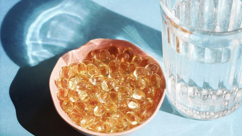 Bowl of vitamin D supplements.