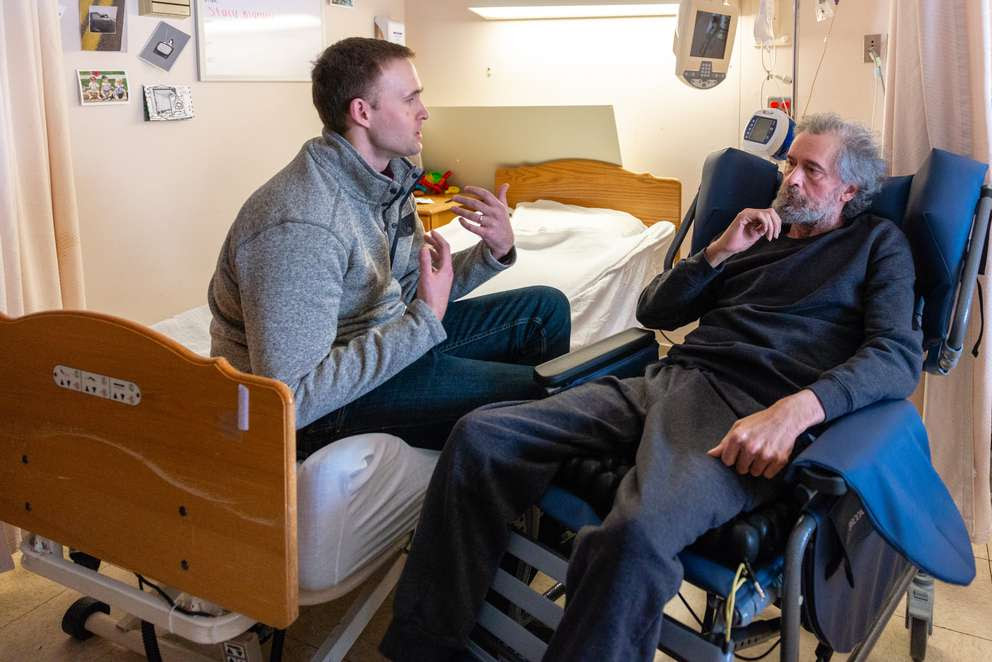 Phil Levering (left) says his father, Mark Levering, used to have a calm demeanor but now exhibits signs of aggression due to a brain injury he suffered after a surgery gone wrong.