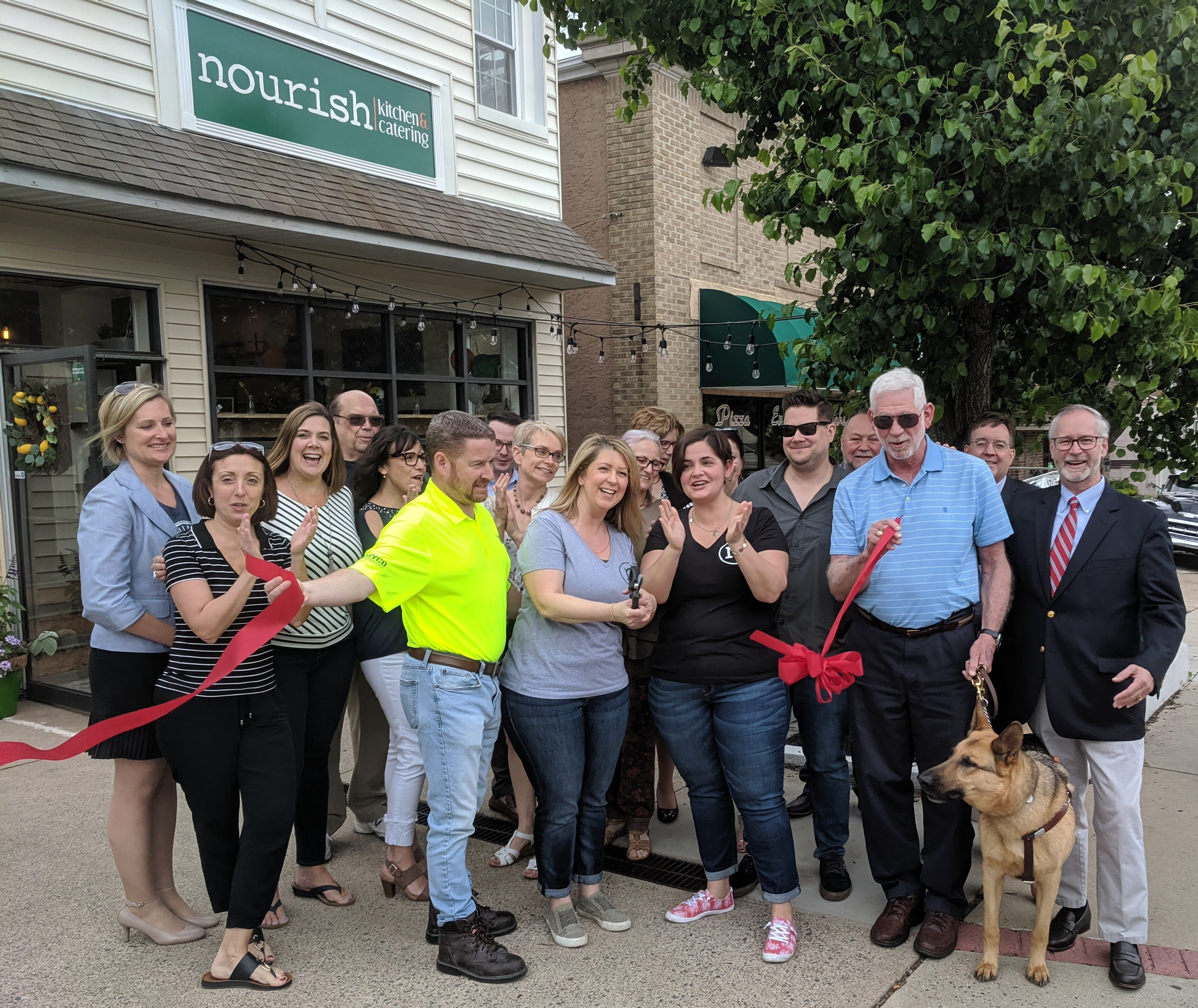 Group shot in front of Nourish Kitchen & Catering