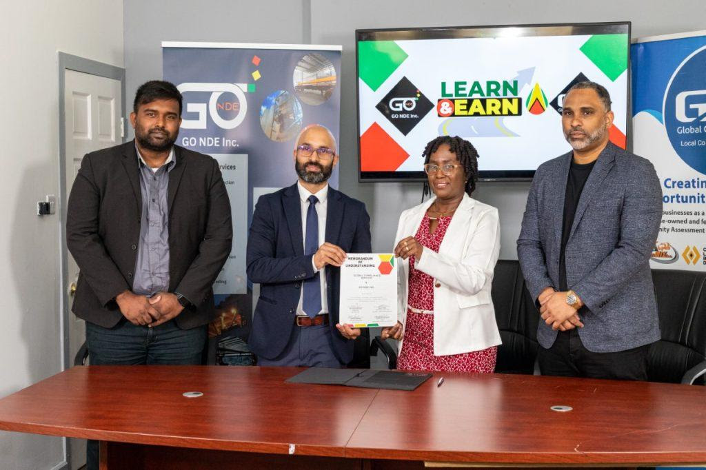 MOU signing, from left to right: Joshua Samuel General Manager GO NDE, Managing Director of GO NDE Nicholas Deygoo, Candelle Bostwick CEO Global Compliance Service Guyana Inc. David Pope, Regional Director of Global Compliance Service