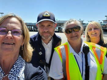 Four people posing for a selfie