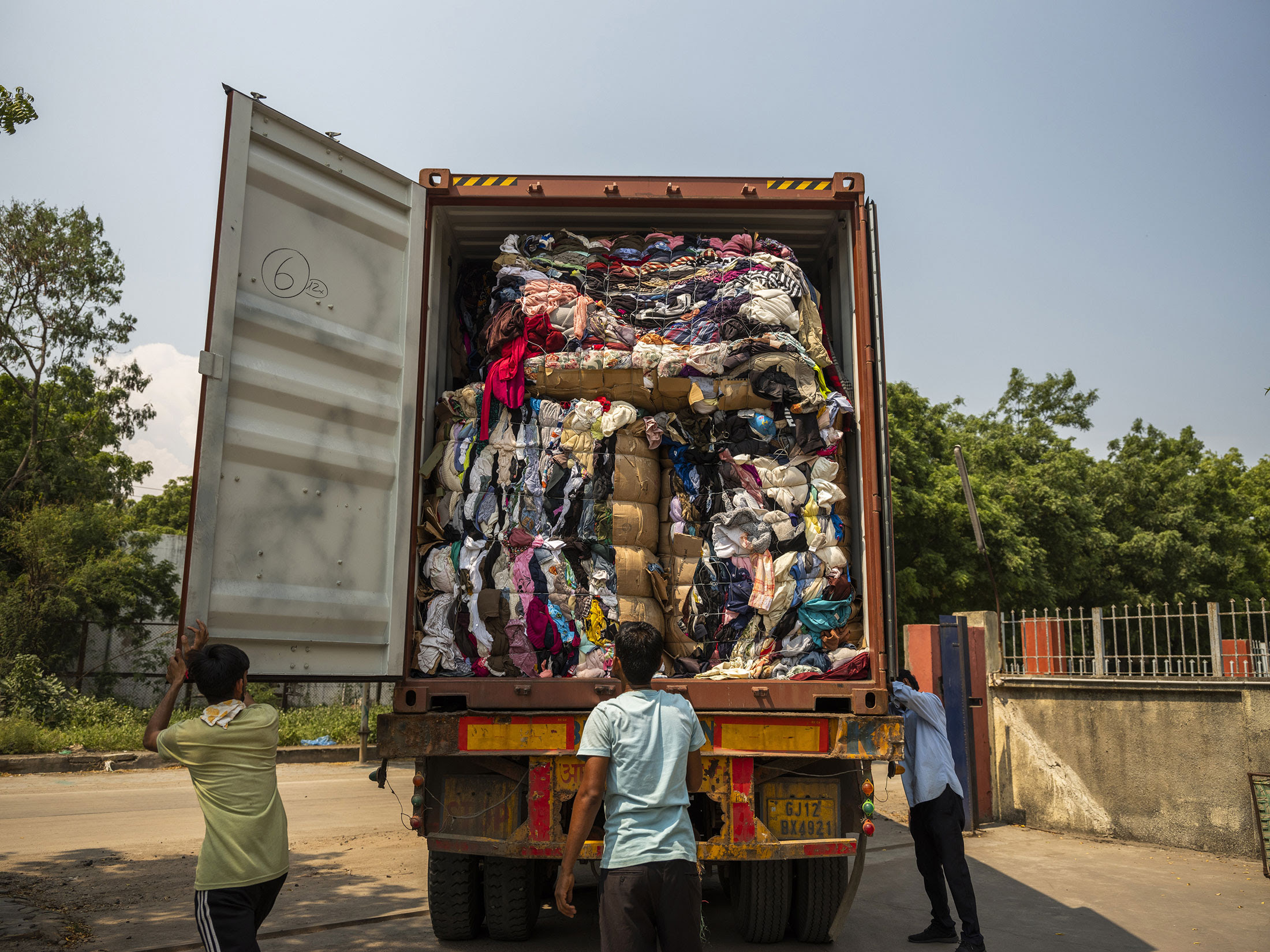Imported clothing arriving at Canam’s sorting facility in Kandla, India