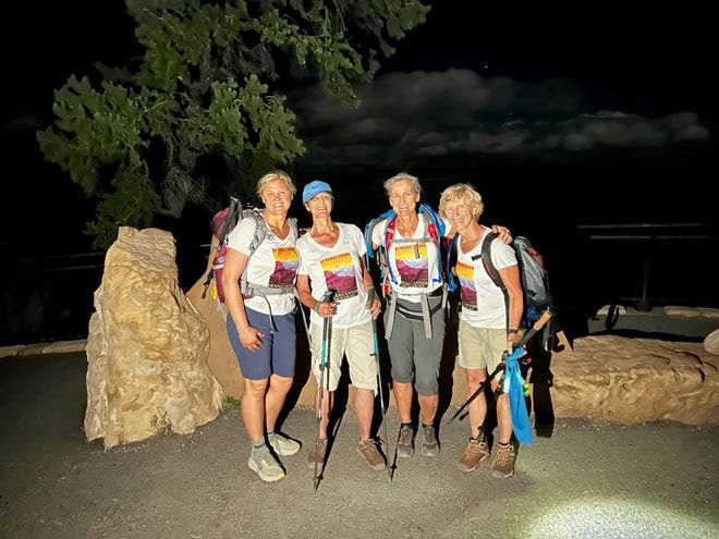 (From left to right) Lynnette Anderson Opp, Fran Anderson, Brenda Sibley and Laurie Usinger pose at the top of the South Rim of the Grand Canyon around 2:45 a.m. after completing a 21-hour hike on Sept. 4, 2023.