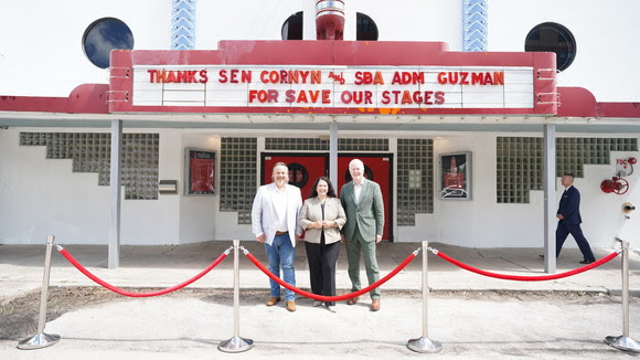 Three people standing outside.