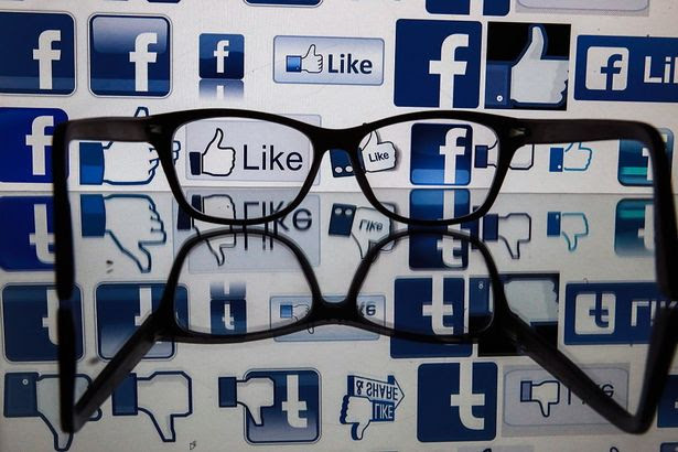 ST PETERSBURG, RUSSIA - NOVEMBER 16, 2016: Glasses on a reflective surface in front of a computer screen showing Facebook logos. Sergei Konkov/TASS (Photo by Sergei Konkov\\TASS via Getty Images)