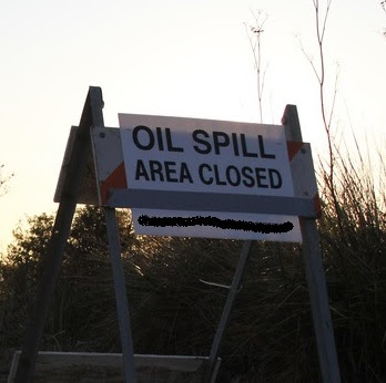 Sign Closing Beach for Oil Spill