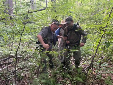 Rangers assist hikers through woods