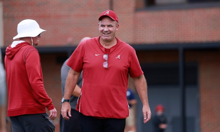 Bill O'Brien smiles while going through practice