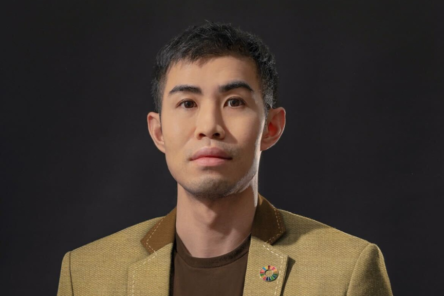 A portrait photograph of Kenneth Kwok looking into the camera