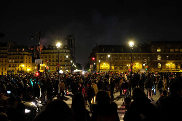 Slide 6 of 31: Mandatory Credit: Photo by Charbonnier Nathanael/News Pictures/REX/Shutterstock (10205294e) Mourners gather as Paris' historic cathedral ravaged by major blaze. Cathedral of Notre-Dame on fire, Paris, France - 15 Apr 2019 The colossal fire swept through the famed Notre-Dame Cathedral in central Paris on Monday afternoon, causing a spire to collapse and raising fears over the future of the nearly millenium old building and its precious artworks.