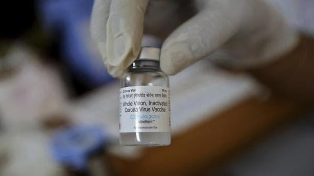  A health worker displays a vial of Bharat Biotech’s COVAXIN vaccine. File 