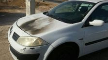 A car hit by a firebomb at the Gush Etzion T-Junction - Oct. 9, 2016