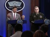 In this Monday, March 2, 2020, file photo, U.S. Defense Secretary Mark Esper, left, speaks during a briefing with the Chairman of the Joint Chiefs of Staff Army Gen. Mark Milley, at the Pentagon in Washington. The U.S. military said Wednesday, March 4, 2020, that it has conducted an airstrike against Taliban forces in southern Afghanistan, only days after American and Taliban officials signed an ambitious peace deal in Doha, Qatar. A U.S. military spokesman said in a tweet Wednesday that it was the first U.S. strike against the militant group in 11 days. (AP Photo/Susan Walsh, File)