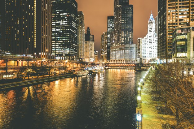 Chicago skyline at night - a destination within reach with our United jet service.
