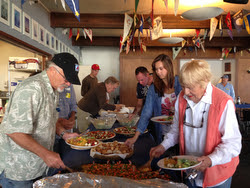 J/24 sailors eating paella dishes at Berkeley YC