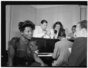 Portrait of Mary Lou Williams, Jack Teagarden, Dixie Bailey, Hank Jones, Tadd Dameron, and Milt Orent, Mary Lou Williams' apartment, New York, N.Y., ca. Aug. 1947. Photo courtesy of the Library of Congress.