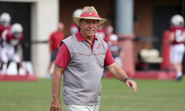 Nick Saban smiling on the field in Alabama's 2022 Spring Football Practice