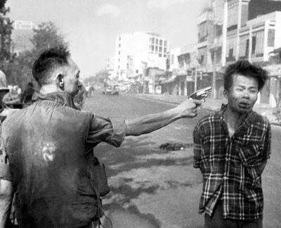 South Vietnamese police chief Nguyen Ngoc Loan executes a Viet Cong guerrilla on Feb. 1, 1968