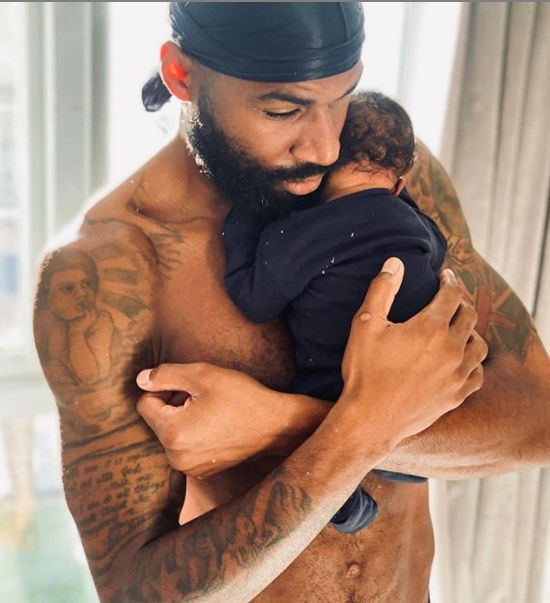 Adorable photo of BBNaija star, Mike Edwards and his baby boy, Mathew