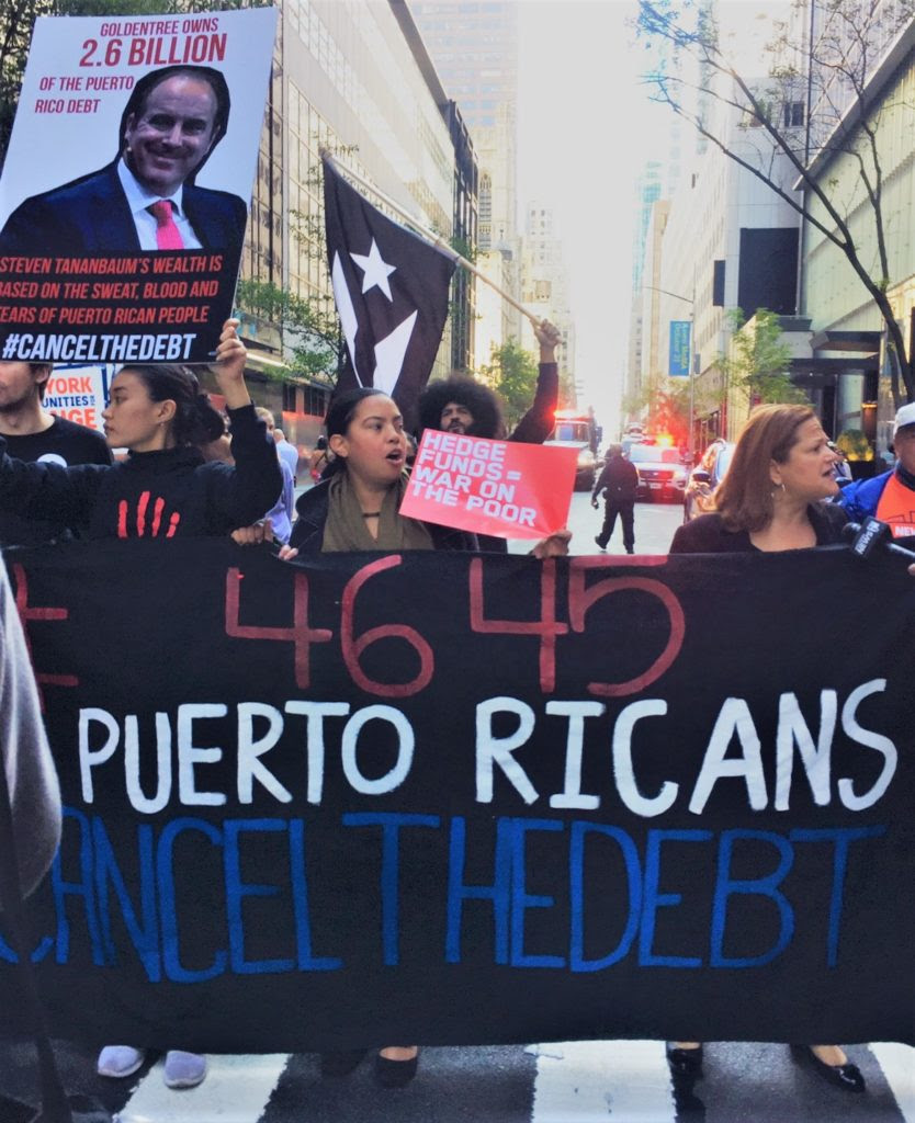 #CancelTheDebt protesters from New York Communities for Change demonstrate against trustee Steven Tananbaum at the October 21 opening of the expanded Museum of Modern Art. Image: Eileen Kinsella.