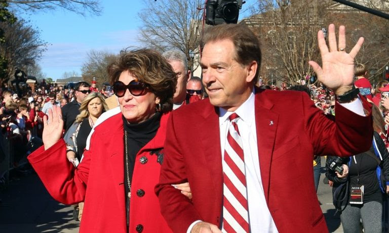 Nick Saban and Miss Terry wave to fans during national championship parade